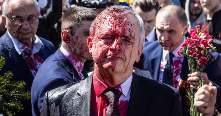 Russian Ambassador Sergei Andreev doused with red paint by protesters in Poland